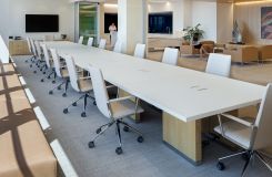 MOTUS reconfigurable tables in flat cut Sen, custom light white trim, etched glass, and polished aluminum. A matching LEX credenza perfectly complements the space. thumbnail